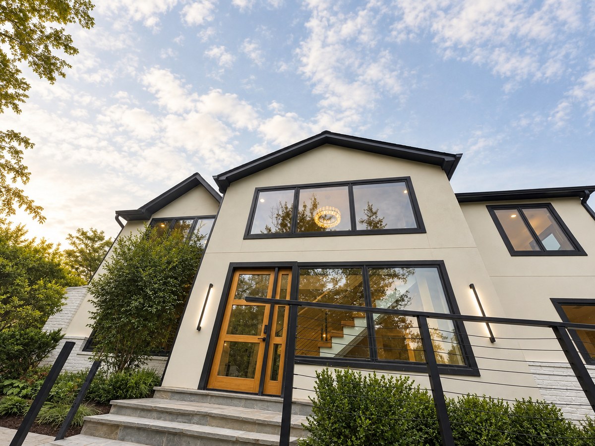 Contemporary two-story residential addition with large black-framed windows