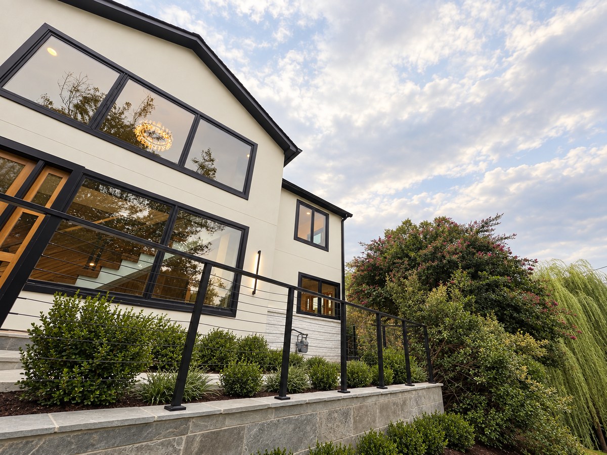Wide exterior view of a completed multi-level home renovation