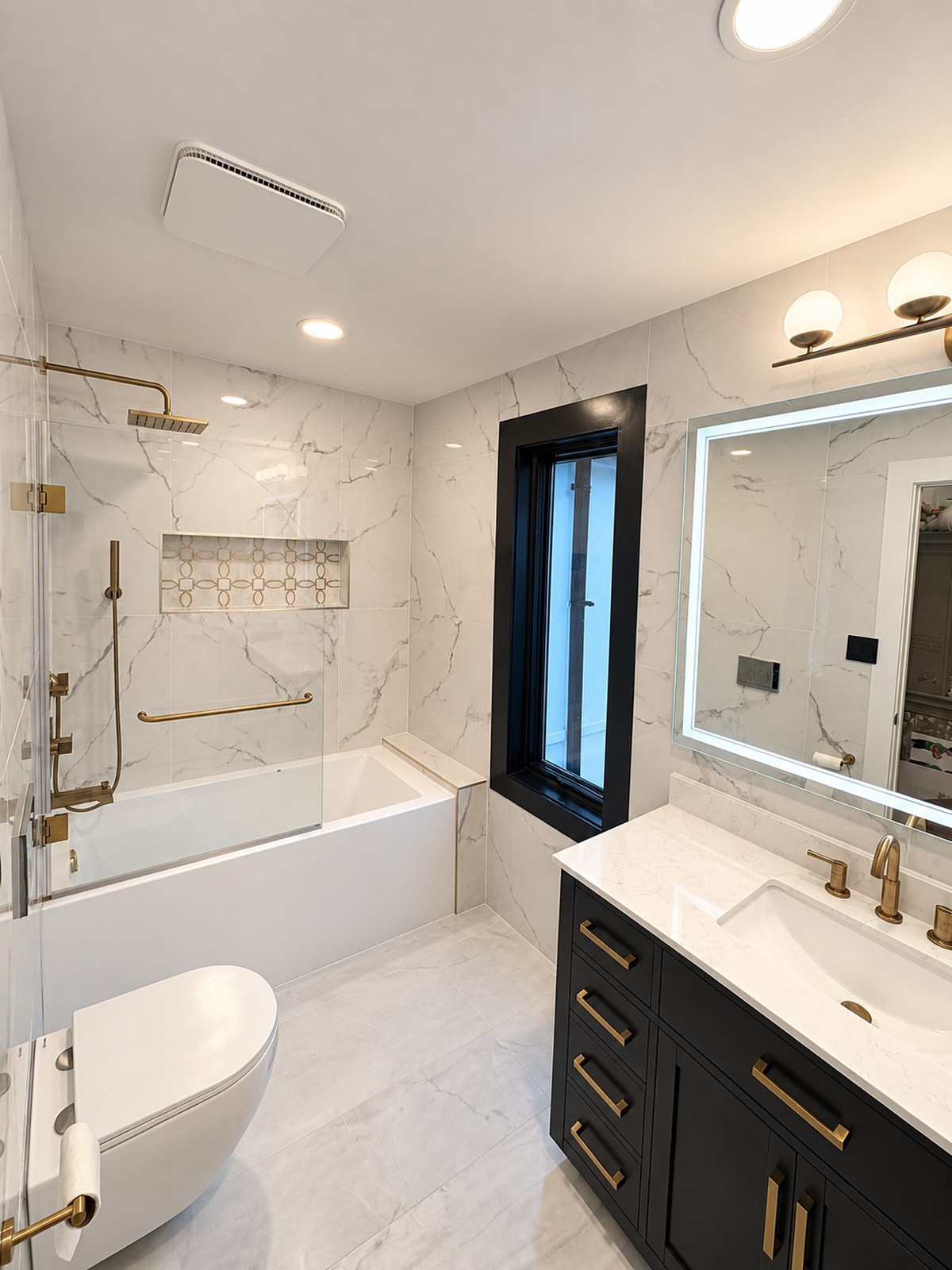 Bright hall bathroom with tub, custom vanity and coordinated fixtures