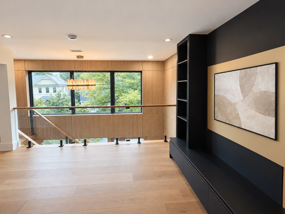 Wide finished media space with custom millwork and oak flooring